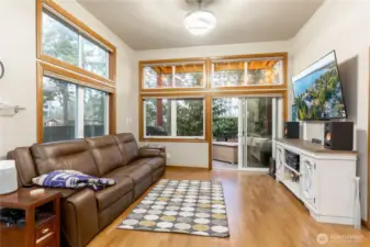 Living room with perspective of high 11-foot ceilings.  Upper blinds have electronic controls.