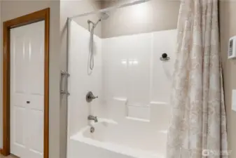 Another view of the full bath second bathroom that shows a great linen storage behind the door.