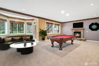 Lower level rec room complete with pool table and backyard access.