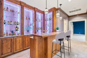 Wet bar complete with sink and beverage cooler.