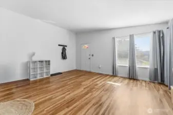 The units have been well updated and maintained over time. Step into the living room featuring vaulted ceilings and abundant natural light.