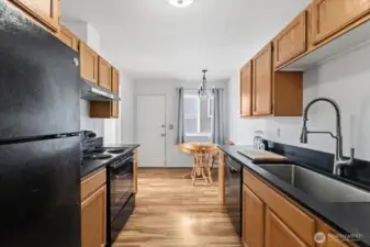 Full kitchen with updated countertops and a cozy dining nook just off the kitchen.