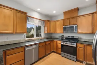 Kitchen and dining area positioned together at the center of the home, providing a functional layout for cooking, dining, and gathering.
