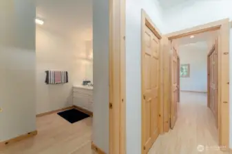 Guest Bath adjacent to formal living room and hallway leading to primary  Lots of storage