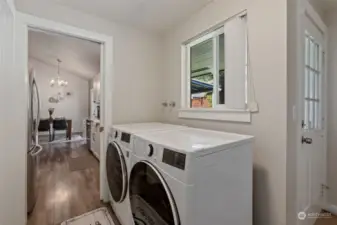 Laundry room, don't miss the extra storage and pocket door. Separate back entrance leading to bath and loft bedroom.