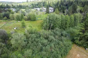 Property extends to houses in distance.