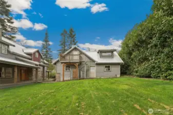 The house and detached 3-car garage with upstairs loft apartment is situated on a beautiful high bank waterfront lot.