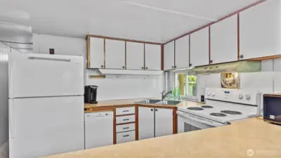 The kitchen has a ton of storage and is light and bright.