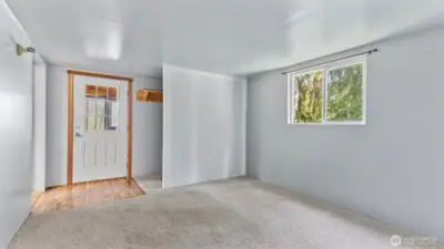 The bonus room, front door and large storage space on the right.