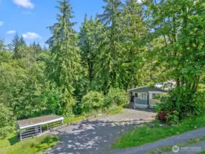 Home is well situated with a territorial view, plenty of parking and a wood shed for those winter nights when you want to use the wood-burning stove.