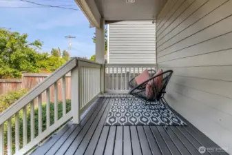 Front porch overlooking the fully fenced front yard