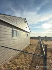 The side and back are completely fenced.  This would be a great area for a dog run or a small garden