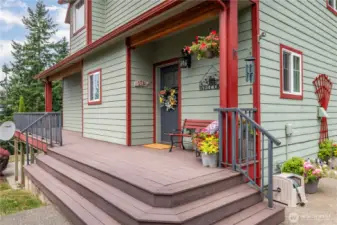 Wide access on the cheery front porch (which can lead you all the way around the full-length back deck)