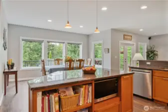 Dining area is convenient to food prep and service (all with beautiful Pacific NW trees in the backdrop!)