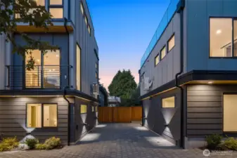 Picture coming home at dusk, the glow of modern architecture guiding you into a space that feels both bold and welcoming.