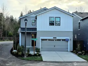Home sits on a desirable corner lot. 2-car garage with 50AMP plug in the garage for your EV.