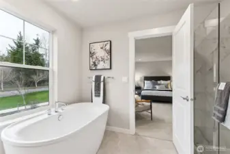 Large soaking tub to relax in primary bathroom. Materials, colors, and finishes will vary. See site agent for details