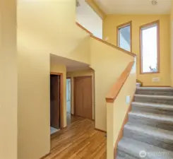 Downstairs has 2 bedrooms, laundry room with half bath, and access to the garage. Coat closet plus hall closet.