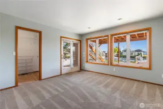 Primary Suite with walk-in closet and private bath with double basins and walk-in shower.