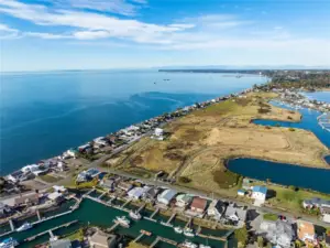 Looking north toward Point Whitehorn, Point Roberts is just visible at the horizon, and the Canadian mountains are often visible as well. The beauty of this peninsula never grows old. Truly an inspiring place to live. That is why there are so many long time residents at Sandy Point. Come see for yourself!