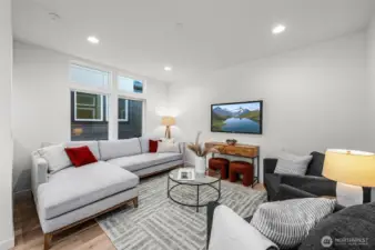 Photos of model home 9213 with similar finishes & floor plan. Light-filled and laid-back — the living area is where comfort meets function. Perfect for movie nights, hosting friends, or just kicking back.