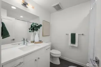 Photos of model home 9213 with similar finishes & floor plan. A fresh, modern full bath with storage for days and a calming vibe you’ll appreciate every single day.