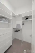 Photos of model home 9213 with similar finishes & floor plan. Walk-in dreams are made of this — built-in shelving, drawers, and room to grow your wardrobe.