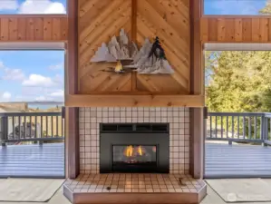 Gas Fireplace in Living Room with sliding glass doors out to Deck