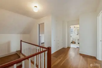 Upstairs hallway with tons of built in storage right outside of bath. You'll love the laundry chute!