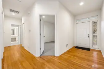 Timeless hard wood floors throughout entry, hallway and kitchen.