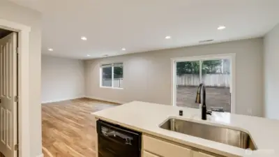 Stay connected to the living and dining areas while cooking or doing dishes, thanks to the home's open and inviting layout.