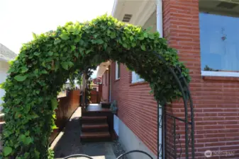 Check out the quaint side entrance to the back yard
