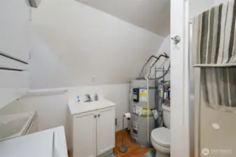 ADU bathroom with washer and dryer