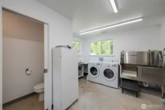 Washer and dryer and large sink, dog wash station and with a half bathroom