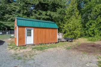 5 large outbuildings including this fairly new large shed with two lofts.