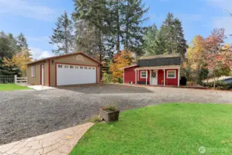 View of detached studio and garage from front porch.