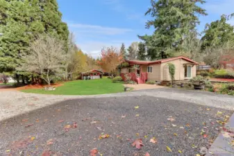 Large gravel driveway can accommodate all your vehicles and toys including RV & boat parking.