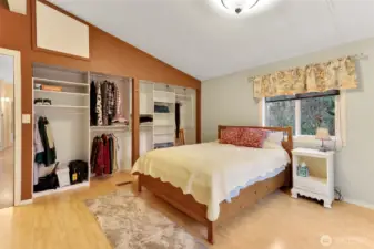 Primary bedroom has closet system to help with organization