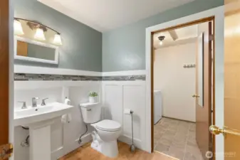 Lower half bath with attached utility/laundry room
