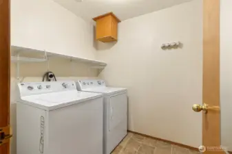 Laundry room with laundry shoot