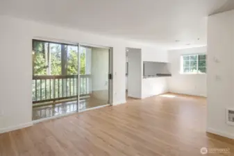 New floors and fresh paint give a bit of gleam to the living room and dining area.