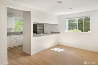 The dining space off the kitchen flows into the living room and offers the perfect intersection of formal elegance and casual atmosphere.