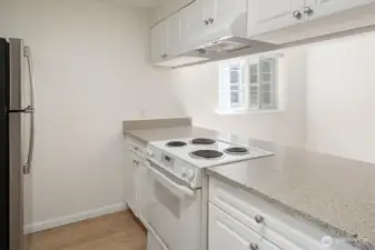 The kitchen is large, well-equipped, and sunny, an excellent space for meal prep.