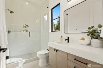 Luxe bath with glass "wall" shower w/ full length shelf for Entry Level Private Suite