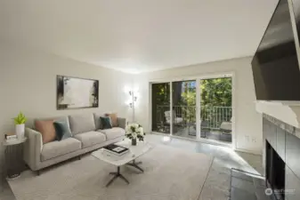 Virtually staged living room opens to private balcony, which is also virtually staged.