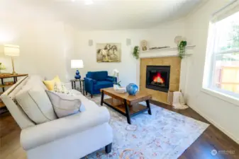 The family room is a cozy retreat, featuring a charming gas fireplace that serves as the room's focal point. This inviting space is perfect for relaxing and entertaining.