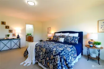 The primary suite is designed to provide comfort and relaxation. This spacious retreat features a private  ensuite bathroom, complete with a soaking tub, a separate shower, and dual vanities, creating a spa-like experience right at home.