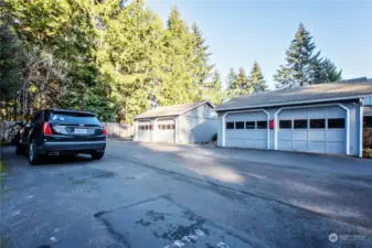 Assigned uncovered parking space is the center space opposite of the garages.