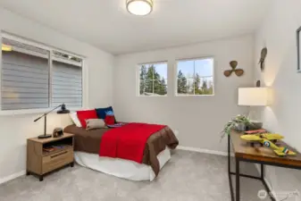 Another Bedroom with two windows, with that much light it would be a grand office