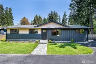 The newly laid sod and charming brick walkway lead you to the front door, enhancing the home's curb appeal and providing a welcoming entrance.